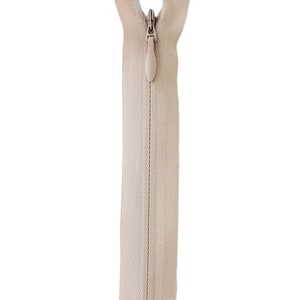 May include: A tan zipper with a plastic slider. The zipper is closed and the slider is in the up position. The zipper is labeled "572 TAN".