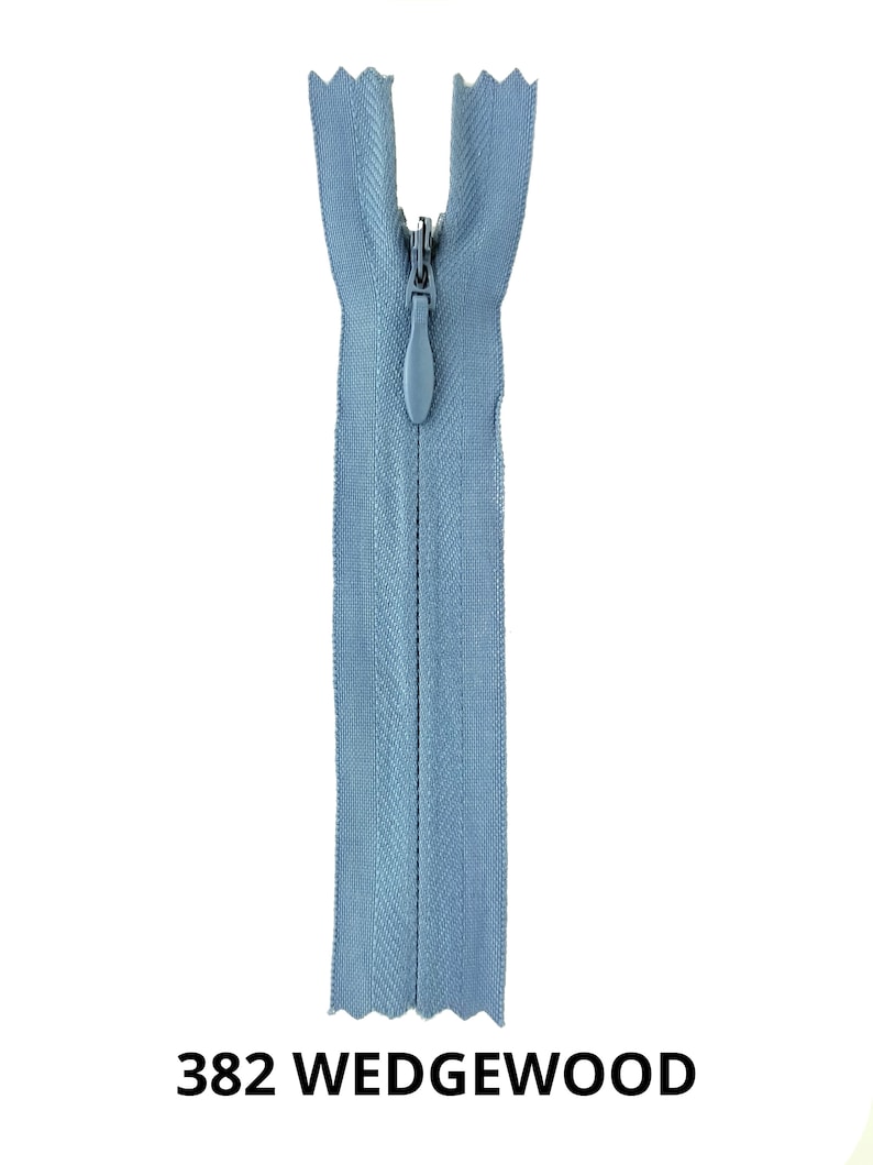 May include: A light blue zipper with a plastic slider. The zipper is open and the slider is in the middle of the zipper. The zipper is labeled "382 WEDGEWOOD".