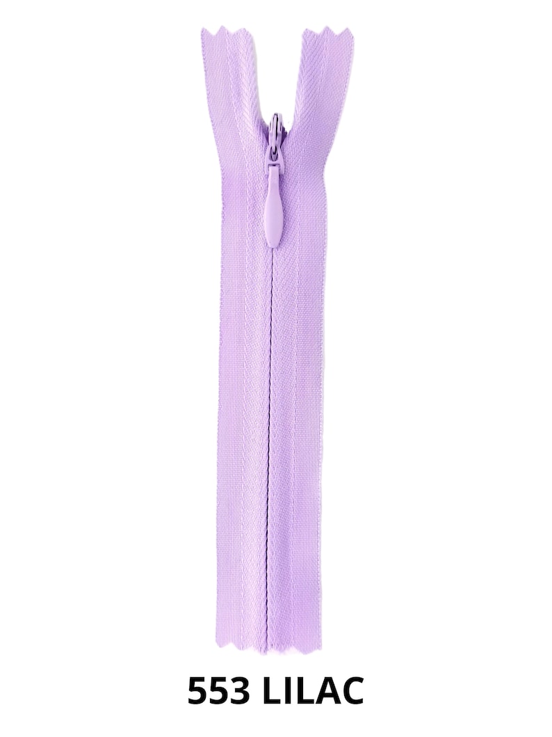 May include: A lilac zipper with a plastic slider. The zipper is closed and the slider is in the center of the zipper.