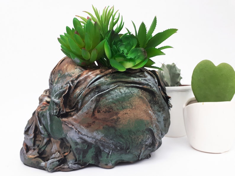 Large Skull pot complete with faux succulents