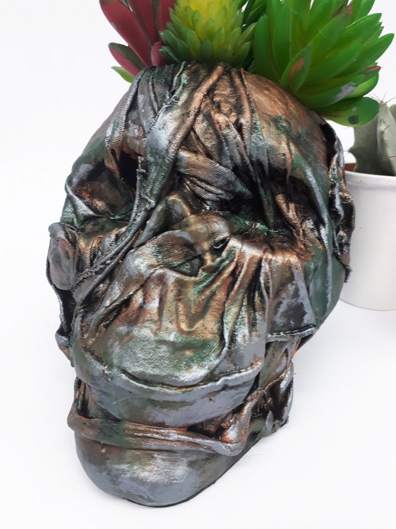 Large Skull pot complete with faux succulents