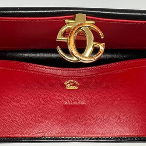 Cartera vintage de piel negra Gucci, años 80, fabricada en Italia, objeto de colección de lujo poco común