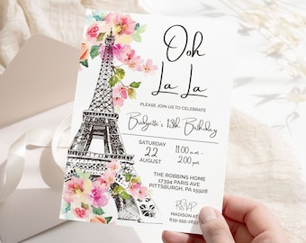 May include: A white invitation card with the Eiffel Tower illustration and the words "Ooh La La". The tower is black and white, with pink and red floral accents. The invitation is for Bridgette's 13th birthday, with the date and time listed.