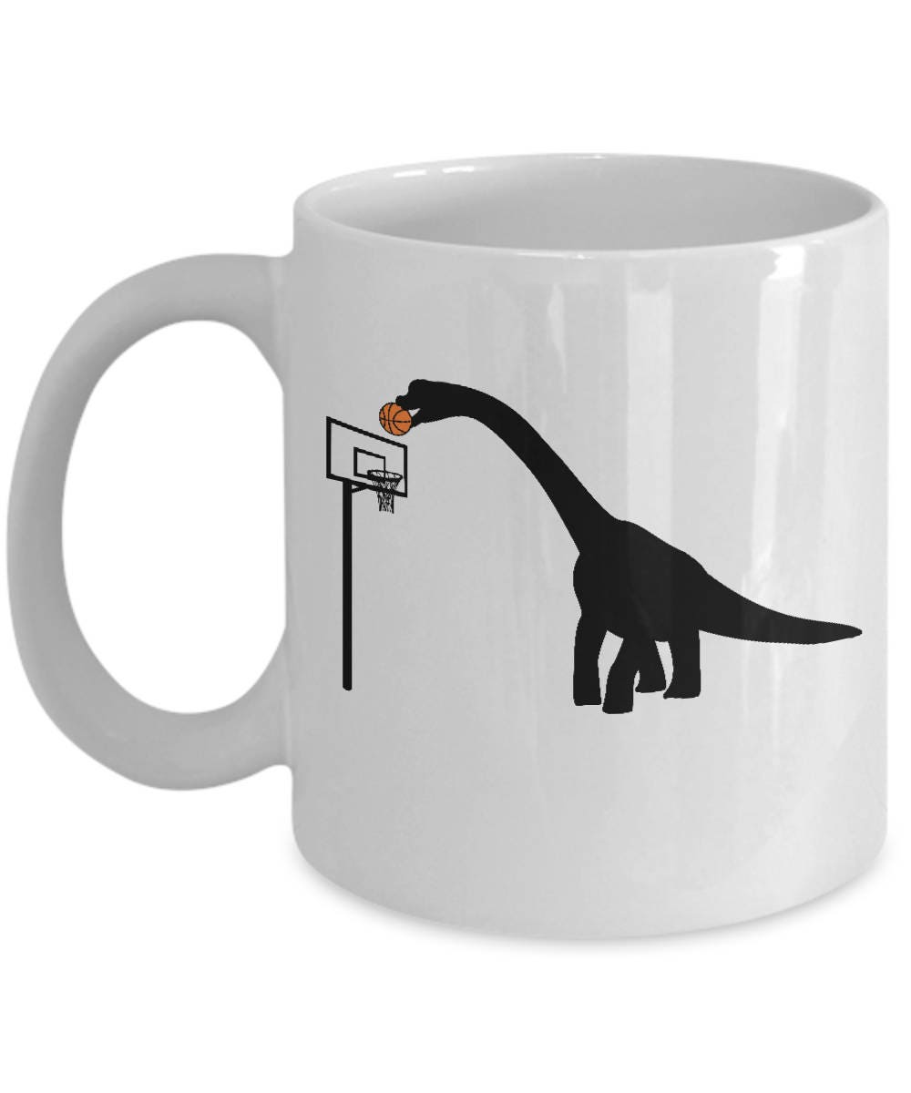 Discover Dinosaur Playing Basketball Coffee Mug