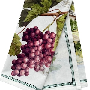 May include: A white kitchen towel with a green border features a watercolor illustration of a bunch of purple grapes hanging from a vine with green leaves.
