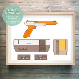 May include: A digital download print of a retro video game console, controller, and light gun. The console is brown and white with a yellow cartridge slot. The controller is grey with a red, white, and blue button layout. The light gun is orange and white with a black trigger.