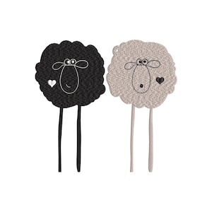 May include: Two embroidered sheep, one black and one grey, with whimsical faces and long legs. The black sheep has a white heart, and the grey sheep has a black heart. The sheep are set against a white background.