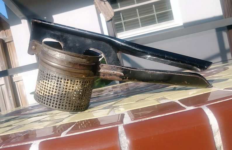Rustic country kitchen ricer. Vintage kitchen Universal potato masher