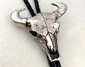 country & western bull bolo tie bronze tone on leather lace.