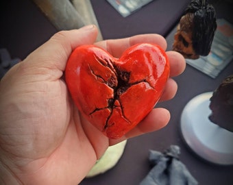 Deseased heart resin magnet with glow effects.