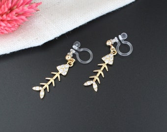 KALI | Earrings with gold fish skeleton and rhinestones | Invisible clips for non-pierced ears | Contemporary jewelry