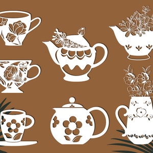 May include: A set of six white ceramic teacups and teapots with floral designs. The teacups and teapots have intricate cutouts and are perfect for a tea party.