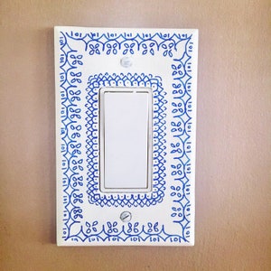 Light switch cover or outlet cover handpainted with boho designs in custom colors. Single or double in toggle or rocker, solid wood