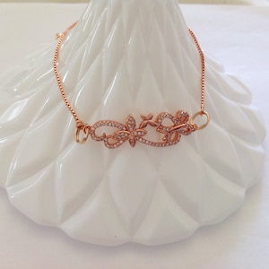 Rhinestone butterfly and flower rose gold adjustable slider bracelet friendship bracelet