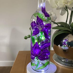 Hand painted purple clematis glass wine bottle light with battery operated cork LED lights