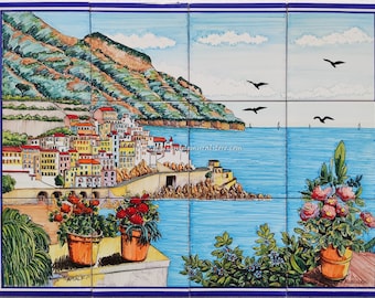 May include: A colorful hand-painted ceramic tile mural depicting a coastal Italian town with colorful buildings, a blue sea, and green hills. The mural is divided into nine tiles and features a signature at the bottom right corner.