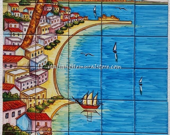 May include: A colorful hand-painted ceramic tile mural depicting a seaside town with a volcano in the background. A man in a white shirt and a red hat sits on a stone wall and eats pasta. The mural is made up of individual tiles and is perfect for adding a touch of Italian charm to any space.