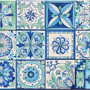 May include: A collection of 16 square tiles featuring intricate blue and green floral designs. The tiles are arranged in a grid pattern and have a white background.