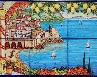 May include: A colorful ceramic tile mural depicting a coastal Italian town with a lemon tree in the foreground, a blue sea with sailboats, and a sandy beach.