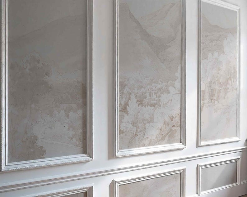 May include: A wall with three framed panels displaying a muted landscape design in beige and brown tones. The panels are set within white moulding, creating a classic, elegant aesthetic. The lower section of the wall also has decorative moulding.