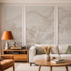 May include: A living room interior with a white sofa, wooden furniture, and a landscape mural. The room includes a wooden coffee table, an orange lamp, and a leather armchair. The decor is complemented by green and orange cushions.