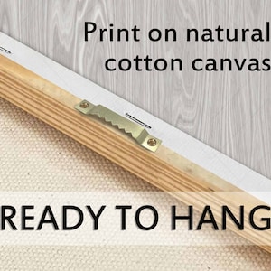 May include: Close-up of the back of a canvas print, showing a wooden frame, metal sawtooth hanger, and the text "Print on natural cotton canvas" and "READY TO HANG". The canvas is stretched over a wooden frame.