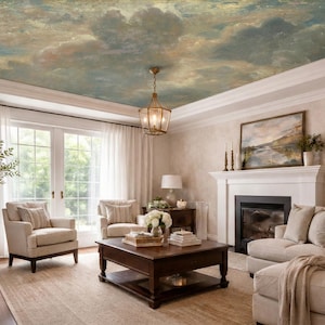 May include: A living room with a painted ceiling depicting a cloudy sky. The room features a fireplace, two armchairs, a sofa, and a coffee table. The color palette includes beige, brown, and white, creating a warm and inviting atmosphere.