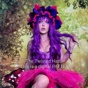 May include: A digital pattern for a crocheted hat with a purple and pink flower design. The hat is worn by a person with purple hair and a pink tutu. The text "The Twisted Hatter This is a digital PATTERN" is visible in the image.