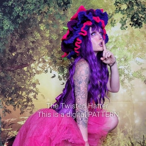 May include: A woman wearing a purple wig and a pink and purple crocheted hat. She is wearing a pink tulle skirt and a purple corset. The text "The Twisted Hatter This is a digital PATTERN" is visible in the image.