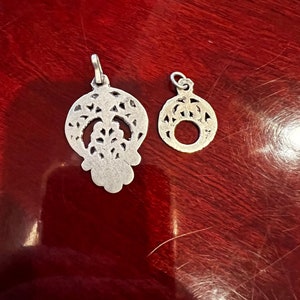 2 Small Silver Toned Pendants