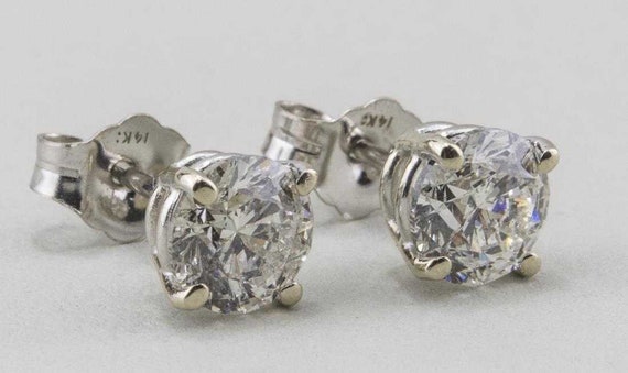 14 Karat White Gold Diamond Solitaire Earrings - image 1