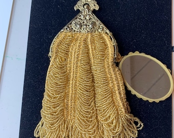 Embrague con cuentas de oro de Christiana