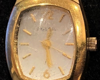 Reloj de pulsera fósil