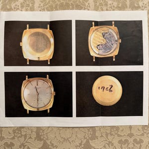 May include: Four images of a gold watch. The first image shows the back of the watch. The second image shows the watch movement. The third image shows the face of the watch. The fourth image shows the back of the watch with the number 1962 written on it.