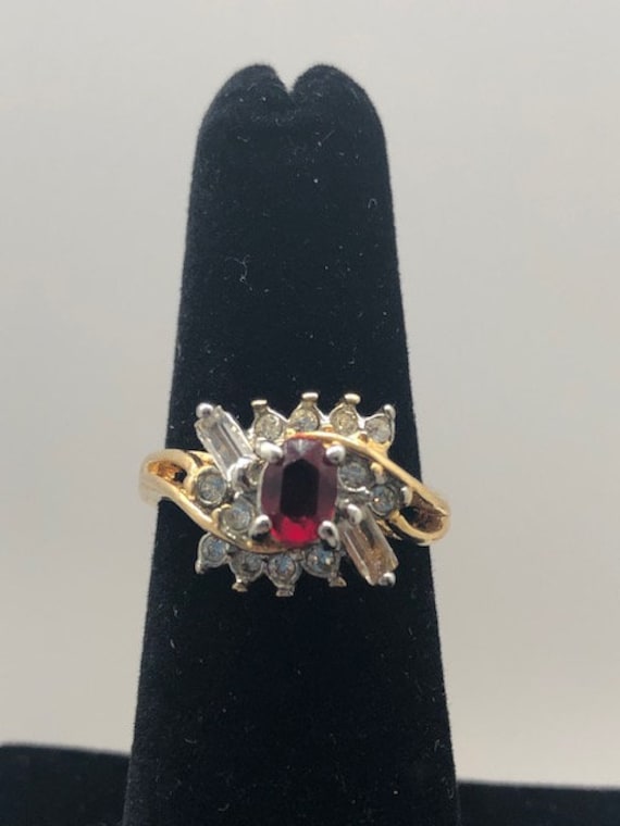 Gold Toned Ring with Ruby Colored Stone - image 1