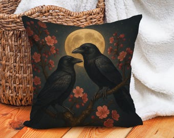 May include: Square cushion featuring two black crows on a flowering branch, set against a full moon and starry night. The cushion has a dark colour scheme with red and orange blossoms.