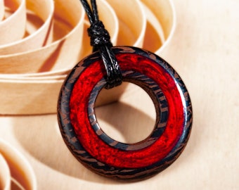 Unique Round Wooden Necklace Featuring Handmade Wood Pendant with Mesmerizing Red Resin. Hypoallergenic and Fashionable Statement Jewelry.