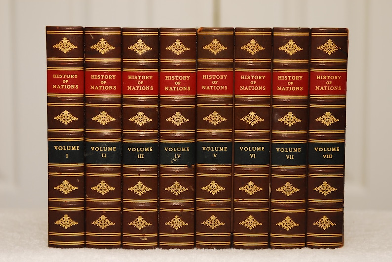 May include: A set of eight brown leather-bound books with gold accents and the title "History of Nations" on the spine. Each book is labeled with a Roman numeral from I to VIII, indicating the volume number.