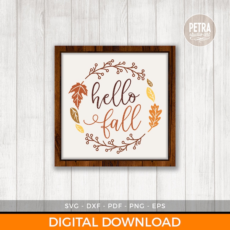 May include: A framed print with the words "hello fall" in brown script, encircled by a wreath of autumn leaves in orange, yellow, and brown. The wooden frame surrounds a white background. The words "DIGITAL DOWNLOAD" are at the bottom.