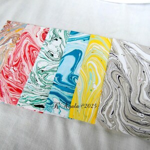 Half a dozen handmade envelopes, marbled paper, with embossed card, Puerto Rico