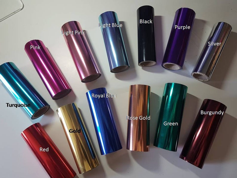 May include: Assortment of 14 rolls of metallic foil in various colours, including turquoise, black, light blue, purple, light pink, silver, pink, red, gold, royal blue, burgundy, rose gold, and green.