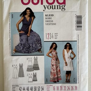 May include: A Burda Young sewing pattern envelope, featuring images of dresses. The front displays the number 7547, the brand name, and the words "KLEID, ROBE, DRESS, VESTIDO". Includes size charts in EUR and US sizes.