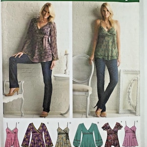 May include: Simplicity sewing pattern featuring six women's tops. The pattern includes a variety of styles, such as wrap tops and camisoles, with different sleeve lengths and details. The image shows the finished garments on models, with the pattern number 3956.