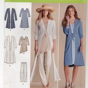 May include: Simplicity sewing pattern 8059 features various women's clothing designs. The pattern includes options for a long cardigan, dress, and pants. The image shows examples of the finished garments in white and blue. The pattern size is XXS-XXL.