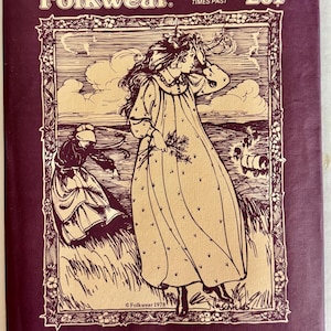 May include: A purple Folkwear sewing pattern envelope for a Prairie Dress, number 201. The front features a black and white line drawing of a person in a long dress and another in an apron, with the text Folkwear, Patterns from Times Past, and Prairie Dress.
