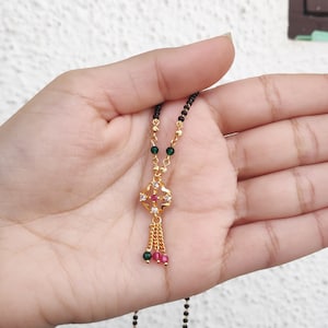 Black Beaded Golden Necklace With Batti 