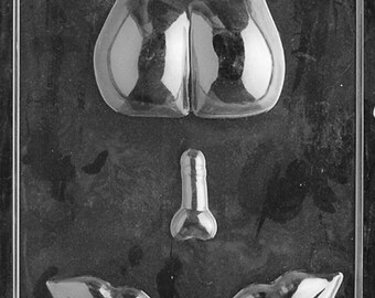 May include: A clear plastic mold with cavities shaped like a pair of testicles, a penis, and a pair of lips. The mold is designed for creating novelty items, likely chocolates or candies, with a humorous theme.