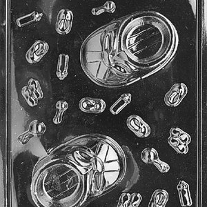 May include: A clear plastic mold for making chocolate baby shower favors. The mold features baby shoes, bottles, and rattles. The mold is labeled "Life of the Party 08686 FDA Approved".