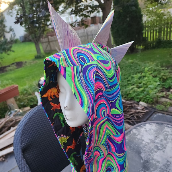 UV reactive hood with holographic spikes a dinosaur print