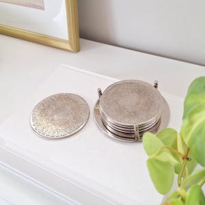 6 Vintage silver plated round coaster holder stand - set of 6 coasters ( vintage charm so has lots of tarnish, scratches , etc. )